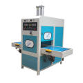 Sliding table high frequency welding and embossing machine